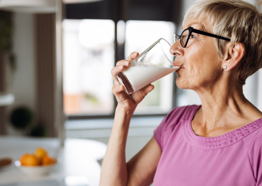 elderly woman drinking milk